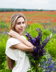 Poster - girl with bouquet of lupine flowers