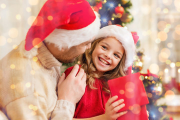 Wall Mural - smiling father and daughter opening gift box