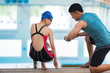 © torwaiphoto - Trainers are teaching swimmer.