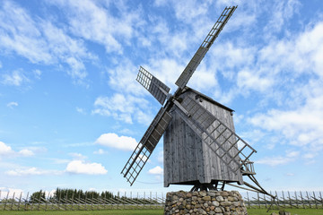 wooden windmill against the sky