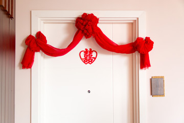 Auspicious traditional Chinese Wedding decor on main door to mean double happiness.