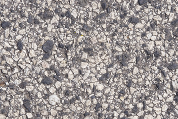 Abstract pebble stones in concrete background texture macro, selective focus