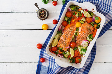 Wall Mural - Baked salmon fillet with vegetables. Top view