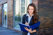 © antoshina_t - Woman holds the folder with documents and writes