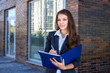 © antoshina_t - Woman holds the folder with documents and writes