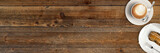 Fototapeta Las - Tasse Cappucino mit Gebäck auf rustikalem Holztisch
