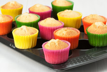 Homemade Colorful Plain Cupcakes On Baking Tray.