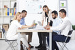 © nikodash - Group Of Business People Having Meeting In Office
