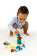 © Anneke - Toddler stacking blocks