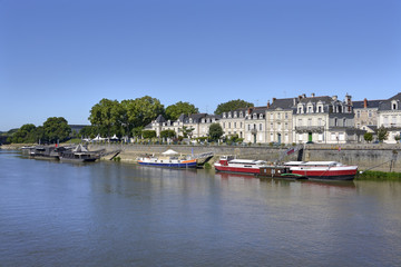 Wall Mural - Barges and boats on the Maine river at Angers, a commune in the Maine-et-Loire department, Pays de la Loire region, in western France 