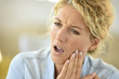 © goodluz - Middle-aged woman suffering toothache