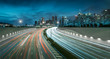 © nattapoomv - Movement of car light with Singapore cityscape skyline during twilight in dramatic tone