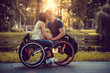 © Fxquadro - Handicapped young couple on two wheelchairs.