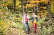 © Halfpoint - Beautiful couple on a walk in sunny autumn forest
