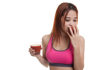 Wall Mural - Beautiful healthy Asian girl with tomato juice and apple.