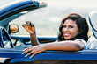African female driver showing car keys.
