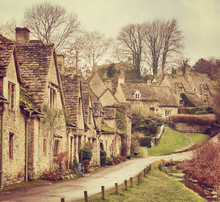 Old Street With Traditional Cottages In Bibury, England, UK. Toned Image.