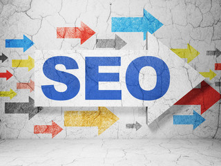 Web development concept: arrow with SEO on grunge wall background