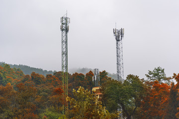 Telecommunications tower at sunrise and blue sky.