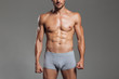 © Drobot Dean - Cropped image of a handsome muscular men body in underwear
