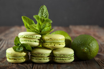 St Patricks Day green macarons with shamrock flags and leprechaun hat