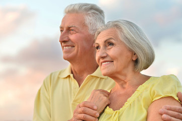 Wall Mural - elderly couple  on the background of sky