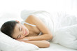 © torwaiphoto - Asian women sleep she would wake up in the morning smiling.