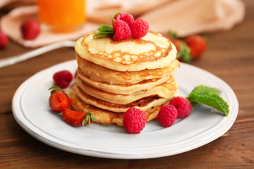 Sticker - Tasty pancakes with berries on plate