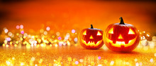 Halloween Pumpkin With Lights And Sparkle Bokeh Background
