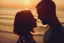 Silhouette Of Couple On Sunset Beach, Beautiful Background About Love And Relationships, Man And Woman