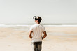 © Westend61 - Mature man standing on the beach wearing VR glasses