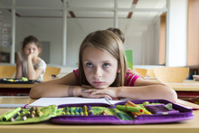 Portrait Of Bored Schoolgirl At Class