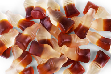 Cola flavored gummy jellies in the shape of cola bottles,backgro