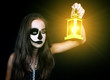 © Natalya Antoshchenko - Halloween. Girl with a flashlight in his hand