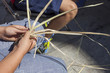 © WH_Pics - Children learning to plait vegetable fibers