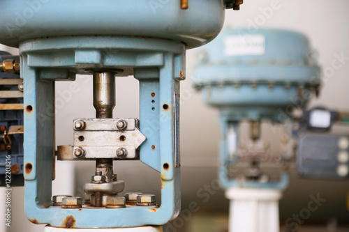 Fotografia, Obraz Pressure control valve in oil and gas process and controlled by Program Logic Control, PLC controller the valve and control instrument gas supply to actuator of the valve as PLC command