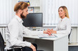© nazarovsergey - man and a woman being interviewed in the office