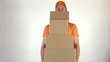 © Alexey Novikov - Courier in orange uniform delivering a pile of parcels. Light grey backround