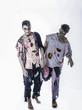 © theartofphoto - Two male zombies standing on black background walking towards camera