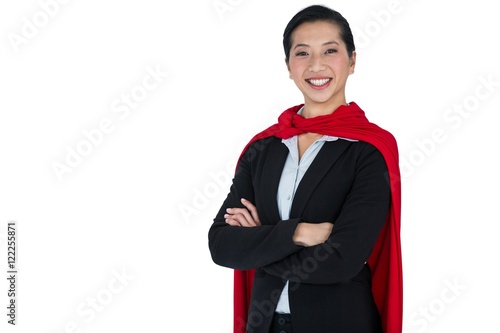 Fotografie, Obraz Woman pretending to be a super hero on white background