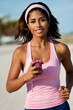Young Hispanic Fitness Woman Jogging Running on Beach