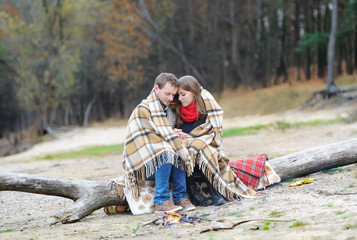 portrait of the happy couple on the beach, river or lake.