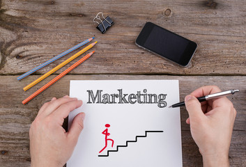Canvas Print - marketing strategy stairs. text on a sheet of paper. on wooden o