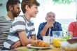 © WavebreakmediaMicro - Multi-generation family sitting at breakfast table