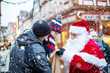 © Irina Schmidt - Little toddler boy with father and Santa Claus on Christmas market