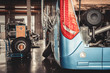 bus and truck waiting for service in the garage, vintage photo a