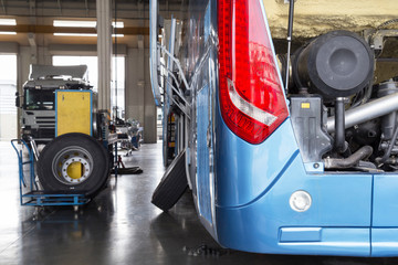 bus and truck waiting for service in the garage