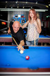 © guruXOX - Beautiful couple flirting on a pool game