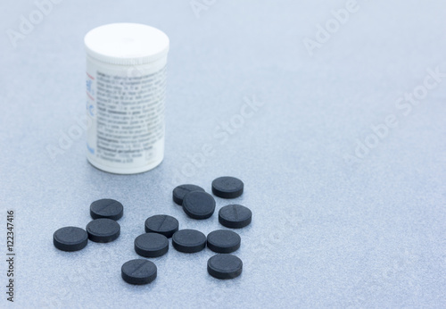 Fotografija Activated Charcoal Tablets For Cleansing The Body On A Gray Background Closeup