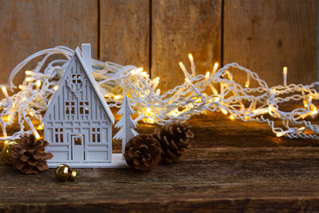 White christmas house glowing with lights in background